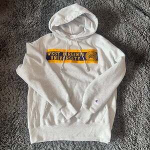 Used WVU Champion Reverse Weave Light Gray Hoodie. Large